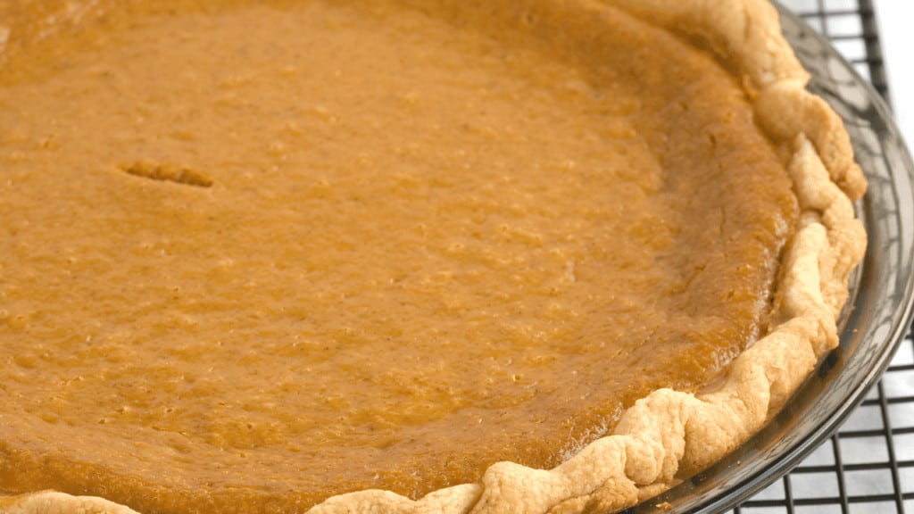 Darker filling and browning crust are signs that a pumpkin pie is ready