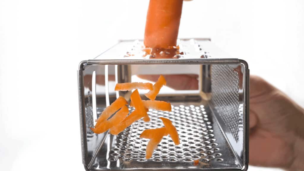 Shredding carrots using a box grater is working well