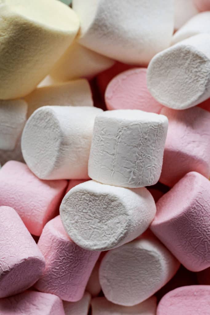 A regular marshmallow weighs just over .01 ounces