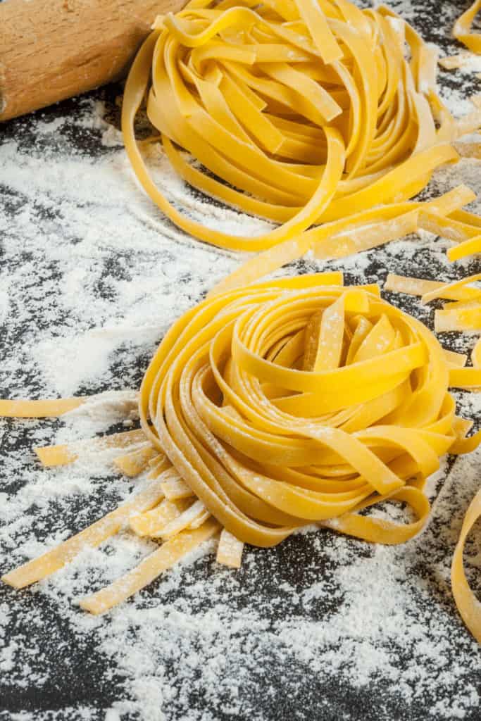 Fresh pasta will hardy gain any weight when cooked so you can apply a 1:1 factor