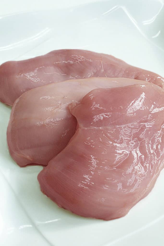 The chicken may be off and the slimy texture could be an indication that the chicken has gone bad