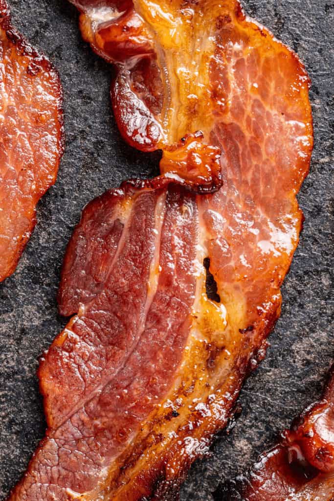 You can cook bacon in an oven instead of a pan if you don't like the white stuff coming out of the bacon
