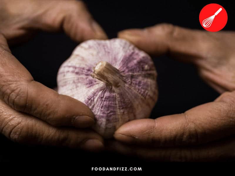 A healthy bulb of garlic should be firm when squeezed. Squishy parts are usually a sign that it is going bad.