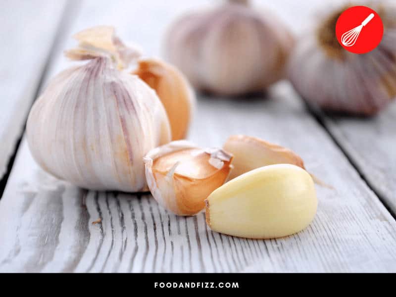 Dark spots on garlic can be due to mold, bruising or bulb mites. Carefully check your garlic before using. Often, you can still use the cloves that do not have those dark spots.