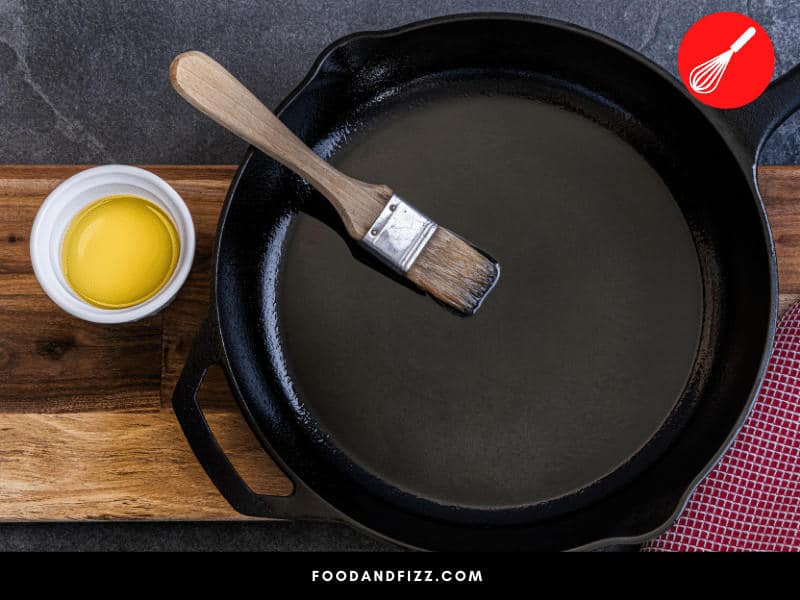 Do not heat an empty skillet. Always make sure to use butter, oil or any fat to cover the base before heating up your cast iron pan.