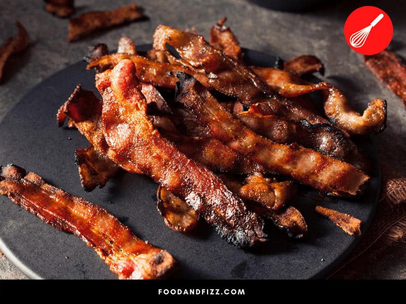 Even cooked bacon should be tossed out if left out at room temperature for longer than four hours.