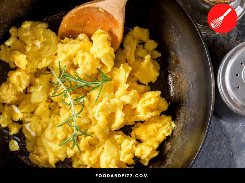 For fluffy, soft scrambled eggs, cook them over low heat.