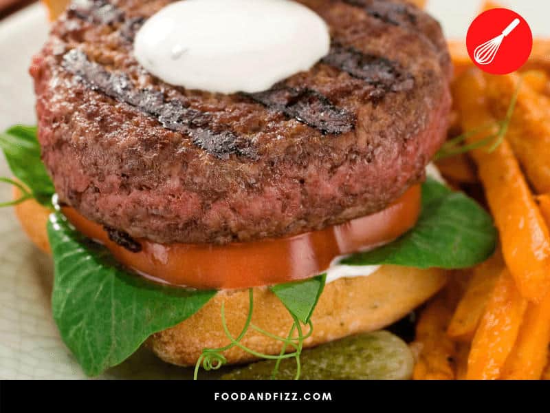 It is safe to eat a burger that's pink in the center as long as it is properly cooked.