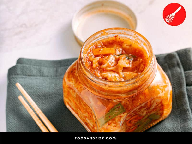 Make sure all vegetables are submerged in the liquid before covering your kimchi and storing in a safe space in the fridge.
