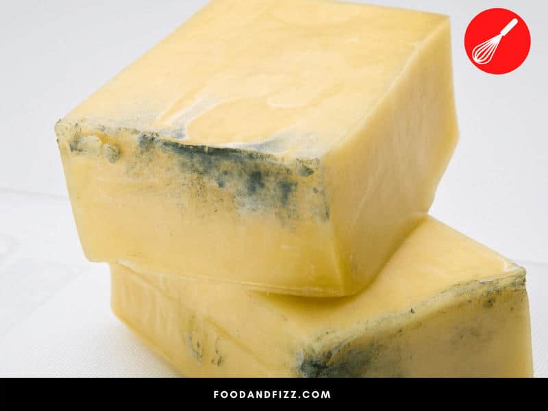 Parmesan Cheese that has visible signs of mold should be thrown out.