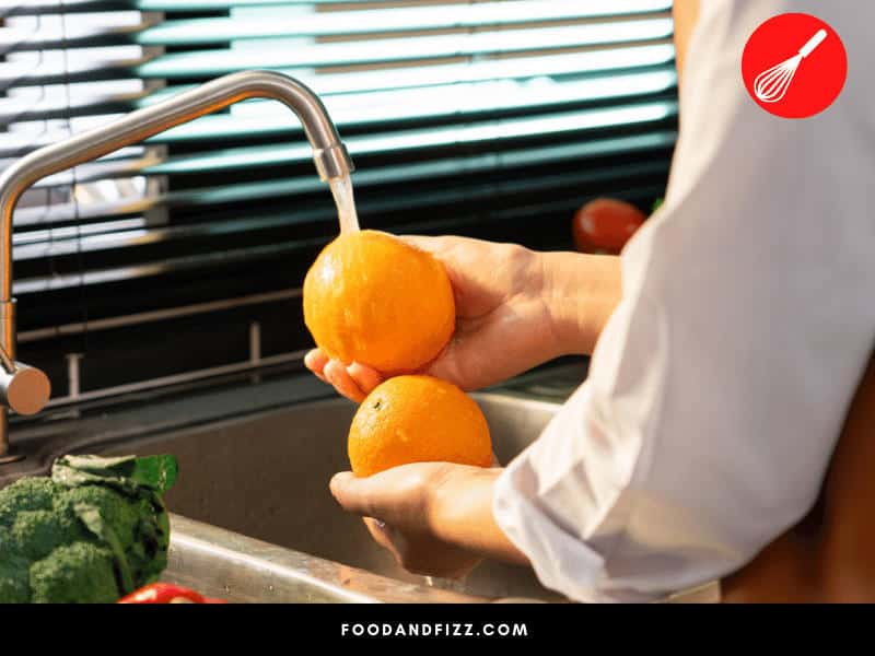 Don't wash oranges until you are ready to consume them. Washing them might promote the development of fruit mold.