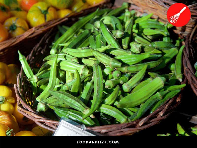 Okra that has been sitting in the grocery store for a long time will show signs of rotting, in the form of black spots.
