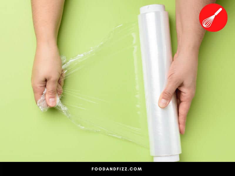 Plastic wrap is made of PVC that contains compounds which may cause potential health issues when it migrates to food.