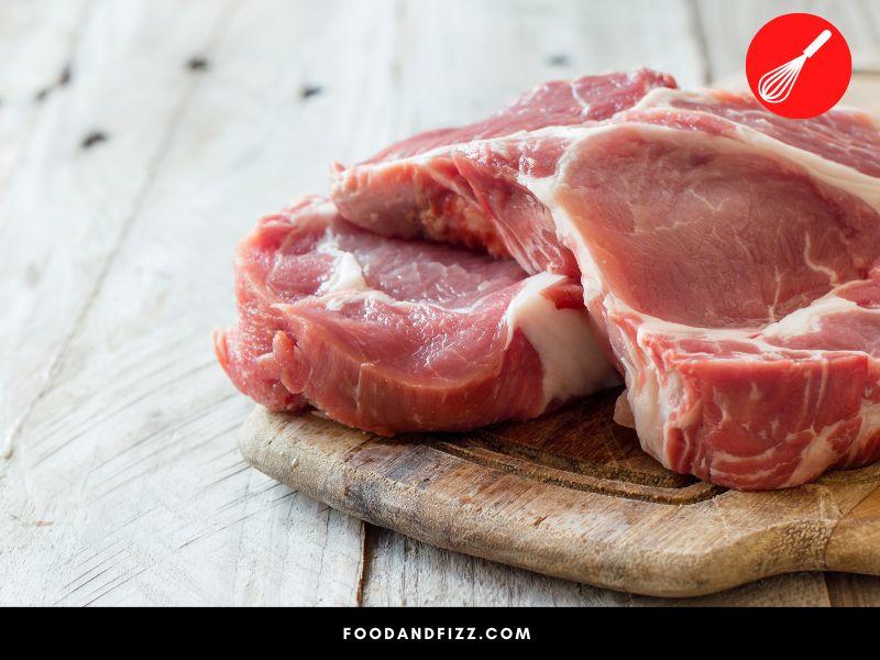 Raw pork should not have any strong smell. If it smells fishy, it has likely gone bad.