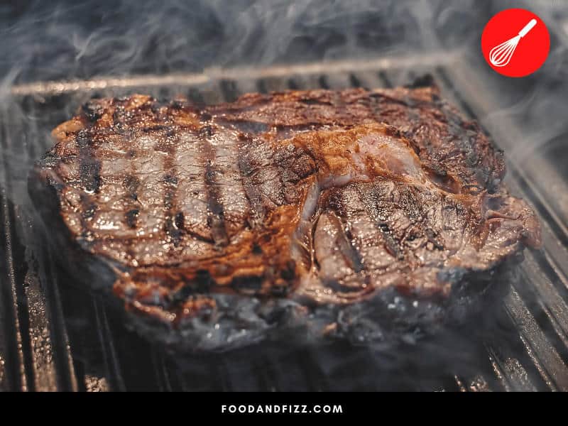 To sear meat on a grill, make sure to cover the grates with oil to prevent sticking and let temperature come up to 400 °F.