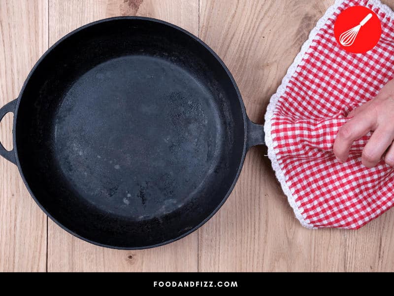 Vinegar is an effective cleaner but cannot be used on cast iron pans as it may damage its coating.