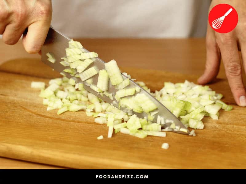 When cooking onions with ground meat, it is important to finely chop onions before adding them to meat to make them blend for seamlessly into you ground meat. Add them prior to cooking your meat.