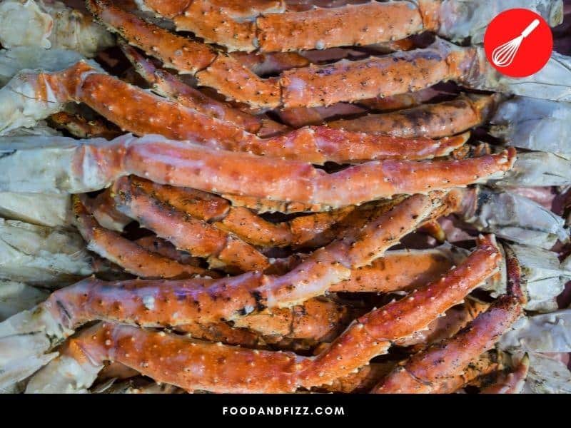 Black spots on crab legs may be caused by shell shedding, leech eggs or physical trauma.