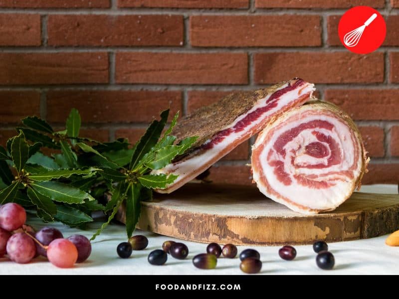 Pancetta arrotolata is tightly rolled into a cylindrical shape and air dried and matured.