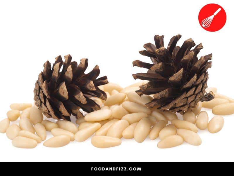 Pine cones naturally let go of pine nuts when subjected to dryness and heat.