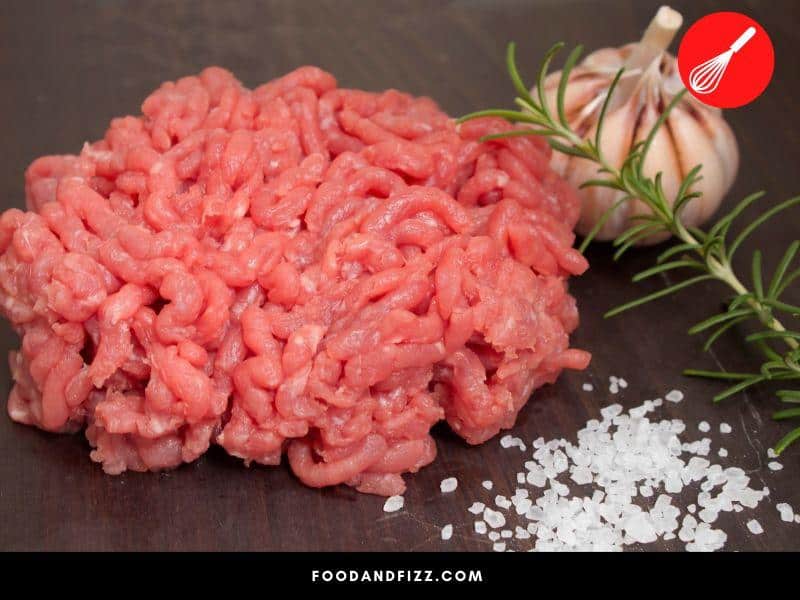 Salting ground meat denatures proteins, allows it to absorb flavor, and helps with binding.