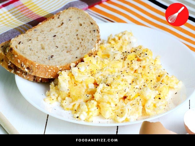 Scrambled eggs should not be left out for more than 2 hours at room temperature.