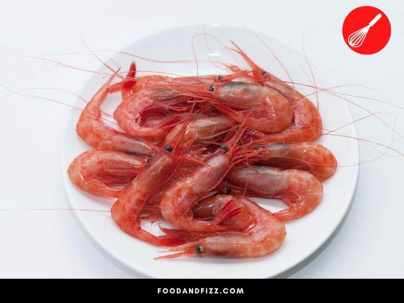 Some shrimp may have naturally pink hues but they look different from the pink hues of cooked shrimp.