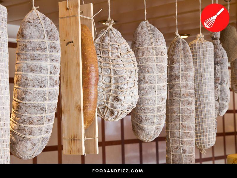 The fermentation and drying process in curing salami is what gives it its characteristic flavor.
