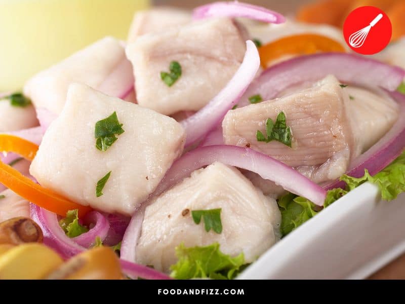 The lime juice in ceviche, an acid, cooks the raw fish and turns it into a white color.