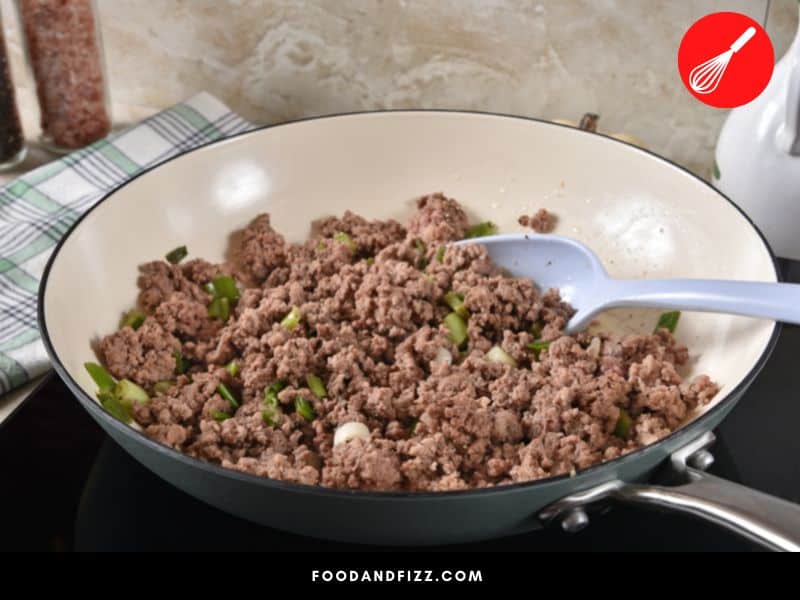Cooking ground beef turns it a brown color.