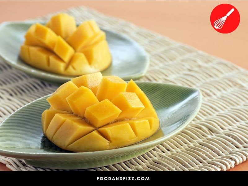 Mangoes may easily be diced by making square cuts on each mango cheek without cutting through the skin.