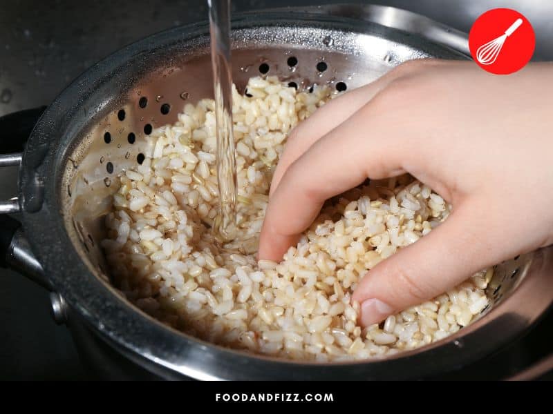 Rinse rice over a colander or strainer and swish around to get rid of dirt and impurities.