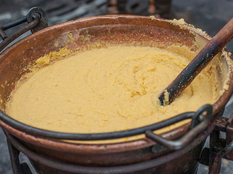 Polenta is creamy and porridge-like when just boiled, but firms up as it cools.