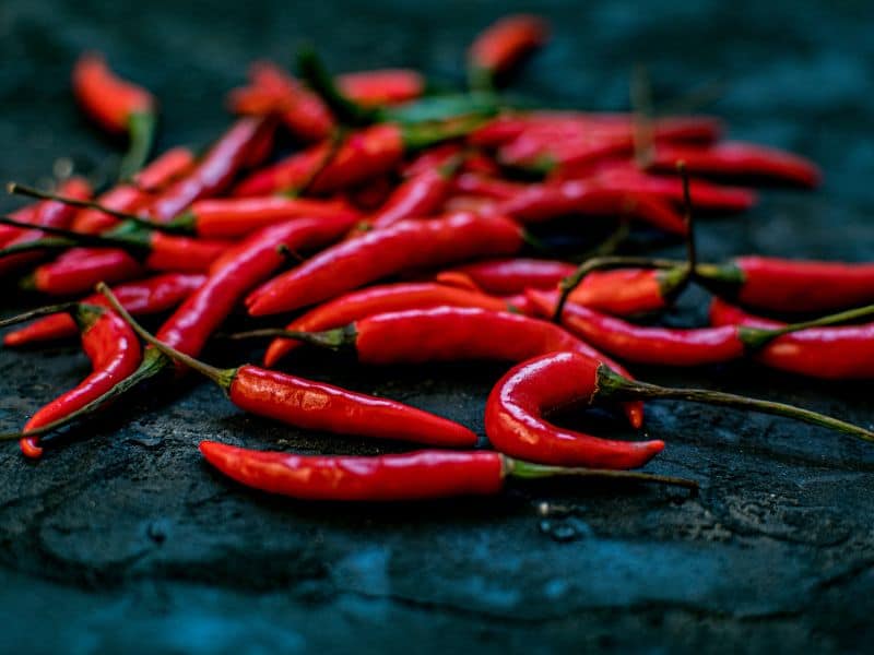 The chilis maintain their bright red color when preserved, and they give red curry its color.